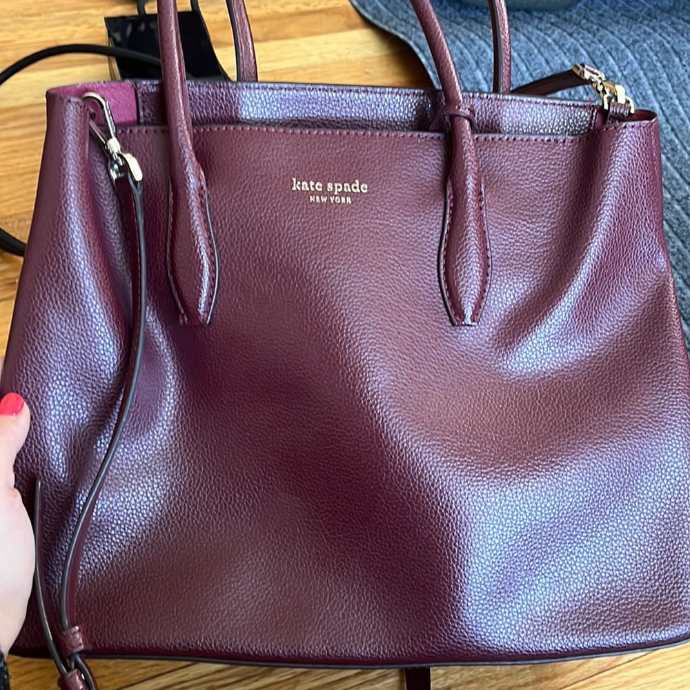 Kate spade purse! Was used and there is some wear and tear on the handles